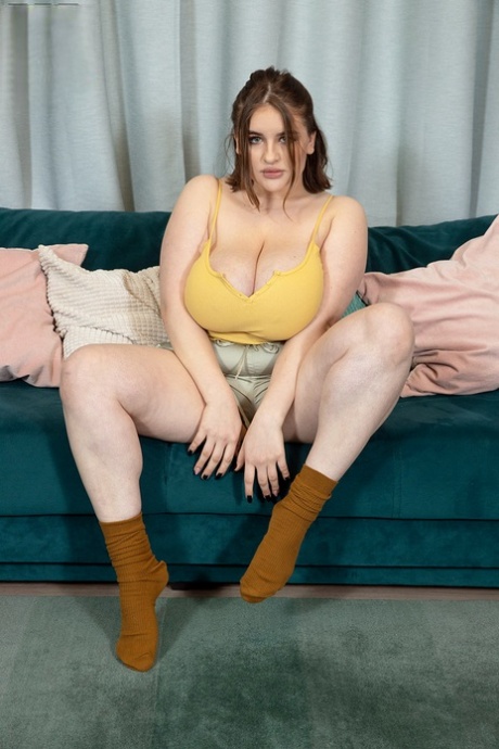 mature chubby lady pleasuring her wet pussy on the sofa sexy xxx photo